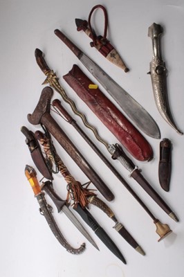 Lot 1027 - Old Arab white metal mounted and amber hilted Jambia and collection of daggers