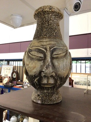 Lot 235 - African carved greenstone vase with mask decoration on both sides, 40cm high