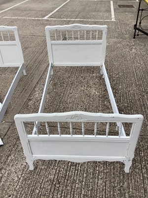 Lot 1188 - White painted double bed with spindle decoration, and a pair of matching single beds