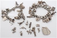 Lot 1628 - Two silver charm bracelets with quantity of...