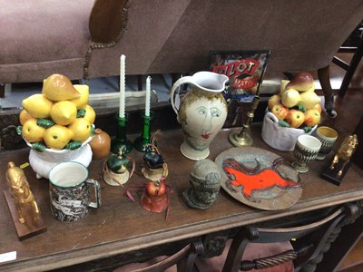 Lot 579 - Sundry decorative items, including Limoges part-dessert service, abstract face-painted jug, BOAC souvenir mug, Georgian brass candlestick, etc