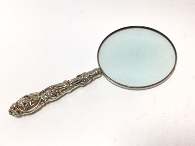 Lot 337 - Circular magnifying glass with ornate Victorian silver handle.