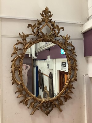 Lot 1405 - A George III style giltwood wall mirror