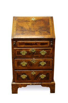 Lot 1414 - A George I style walnut crossbanded bureau of small size