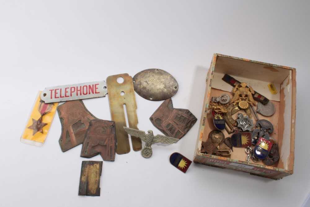 Lot 757 - Second World War medals comprising Africa Star x2 and War medal together with various other military badges including a Nazi badge and an enamel telephone box door plaque