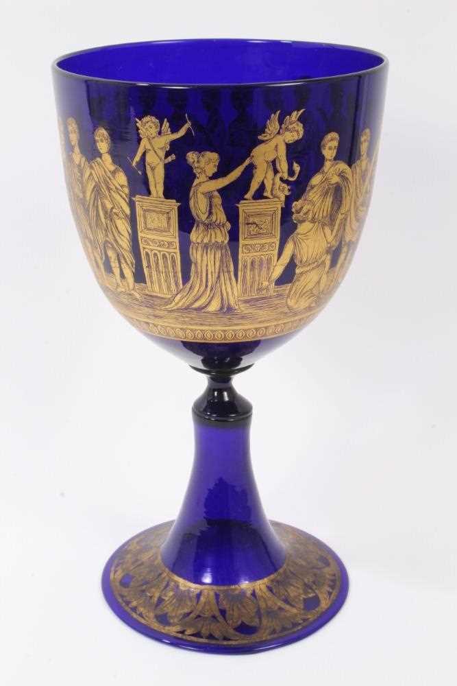 Lot 133 - A large 19th century Bristol blue glass goblet, decorated in tooled gilt with a continuing band of classical figures