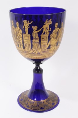 Lot 320 - A large 19th century Bristol blue glass goblet, decorated in tooled gilt with a continuing band of classical figures