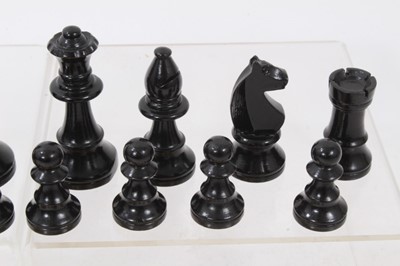 Lot 755 - Antique boxwood chess set in stained wooden box