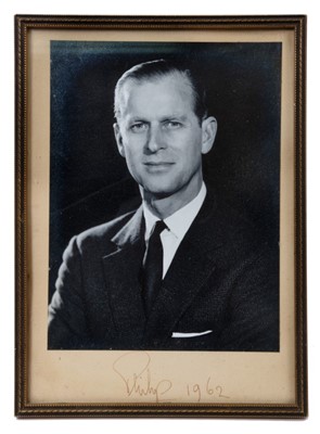 Lot 7 - H.R.H The Duke of Edinburgh, signed presentation portrait photograph of the Duke wearing a dark suit signed in ink on the mount 'Philip 1962' in glazed frame with easel back  226 x 19 cm
