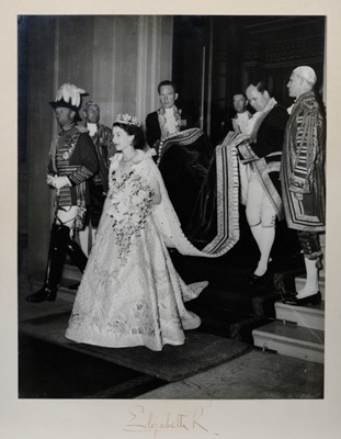 Lot 8 - H.M.Queen Elizabeth II, fine large signed Coronation day photograph of Her Majesty leaving Buckingham Palace for her Coronation with her staff including William Holloway holding her train, signed...