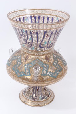 Lot 102 - Fine quality French enamelled glass Persian-style mosque lamp, mid to late 19th century, signed A.Bucan, decorated at the top with Arabic script intertwined with an Arabesque pattern, the central b...