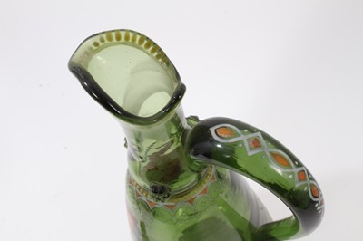 Lot 222 - Unusual Bohemian green glass decanter, enamelled with the Polish coat of arms, inscribed below and dated 1866, decorated with raspberry prunts and enamelled patterns, 38.5cm high