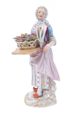 Lot 107 - Meissen porcleain 'Cris de Paris' series figure of a flower seller with a candle, 18th/19th century, polychrome decorated and standing on a gilt scrollwork base, crossed swords mark to base, 14cm h...
