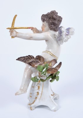 Lot 108 - Meissen figure of Cupid as an archer, circa 1900, shown seated on a scrollwork base, a shot bird on one side and sheaf of arrows on the other, crossed swords mark and impressed model number R 133 t...