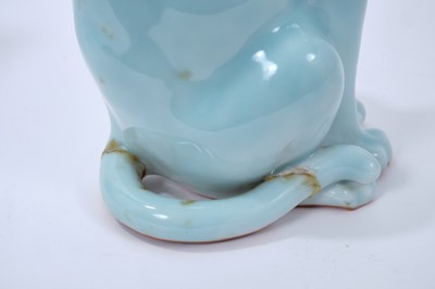 Lot 112 - Good pair of Japanese clair de lune glazed porcelain models of cats, probably early 20th century, shown seated with tails at their sides, 24cm high