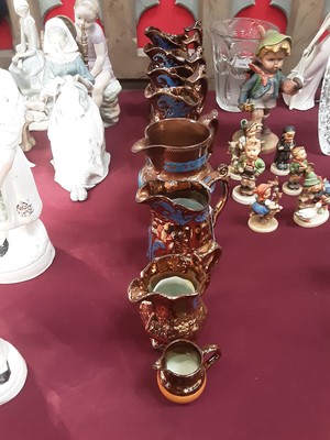 Lot 49 - Collection of copper lustre jugs