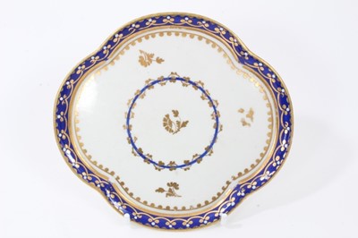 Lot 117 - Derby lobed dish, circa 1800, decorated in blue and gilt with foliate patterns, 13.5cm across