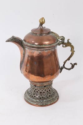 Lot 90 - Middle Eastern copper coffee pot with silvered decoration, raised on a pierced base