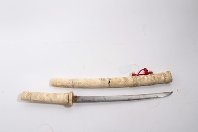 Lot 1033 - Japanese Wakizashi in ornately carved bone scabbard, blade 33.2cm in length