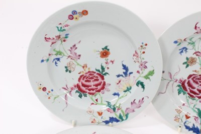 Lot 125 - Set of seven Chinese famille rose porcelain dishes, Qianlong period, decorated with peonies and other flowers, 23cm diameter