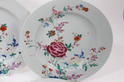 Lot 125 - Set of seven Chinese famille rose porcelain dishes, Qianlong period, decorated with peonies and other flowers, 23cm diameter