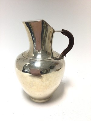 Lot 343 - Victorian silver jug of baluster form, with double hinged cover and leather covered handle