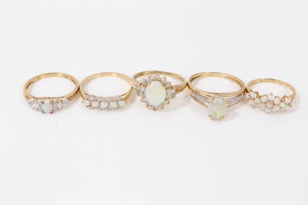 Lot 75 - Five 9ct gold opal rings