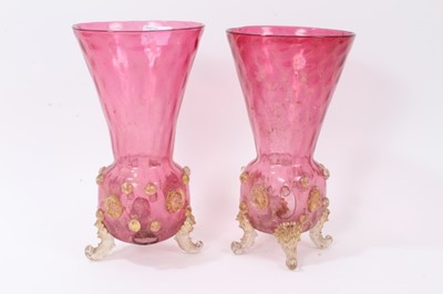 Lot 128 - Impressive late 19th century Murano glass covered goblet, decorated with gold serpents, together with a pair of Murano cranberry glass vases, decorated with gold prunts, lion masks and scrollwork f...