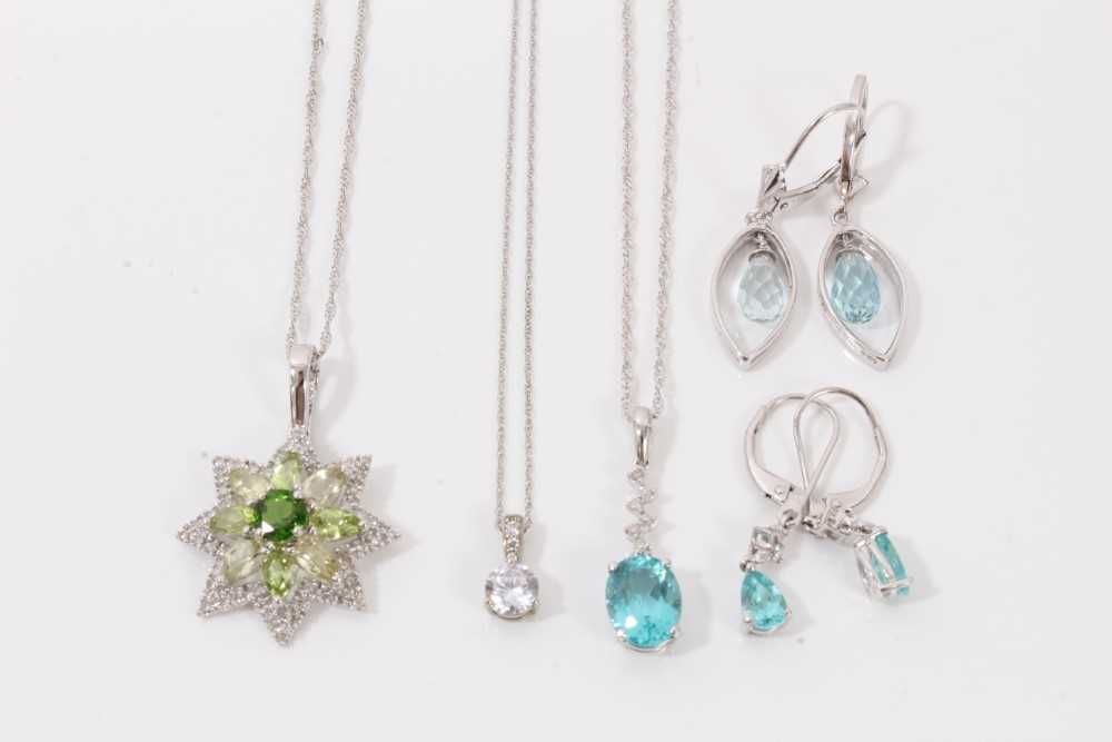 Lot 80 - Group 9ct white gold gem set jewellery to include three pendant necklaces and two pairs of blue stone drop earrings