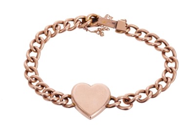 Lot 526 - Edwardian rose gold locket bracelet, the heart-shaped plaque concealing a locket compartment, on a curb link bracelet. Approximately 18cm length.