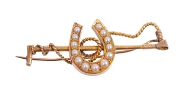 Lot 527 - Victorian gold and seed pearl brooch in the form of a lucky horse shoe and gold riding crop, engraved 'A.L. Feb 9th 1887', approximately 43mm