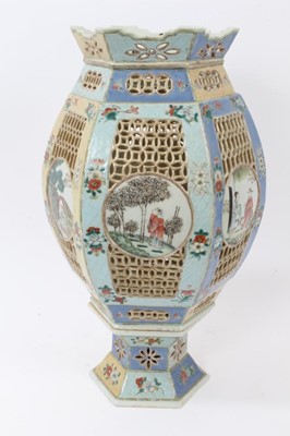 Lot 129 - Chinese famille rose reticulated lantern, 19th century, decorated with circular panels containing figural scenes, on a floral patterned ground, 39cm high