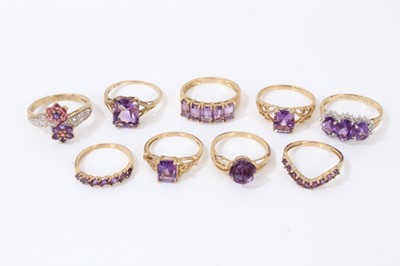 Lot 89 - Nine 9ct gold purple gem stone dress rings
