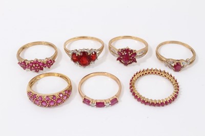 Lot 91 - Seven 9ct gold red stone dress rings