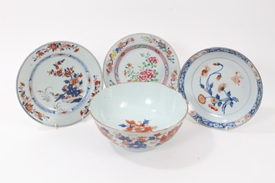 Lot 136 - Four pieces of 18th century Chinese export porcelain, including an Imari bowl, two Imari dishes, and a famille rose dish, each decorated with flowers, the bowl measuring 24cm diameter