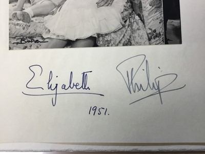 Lot 21 - T.R.H.The Princess Elizabeth and The Duke of Edinburgh, charming signed portrait photograph of the young Royal couple with a young Prince Charles and infant Princess Anne - signed in ink on mount'...