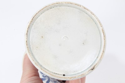 Lot 144 - English pearlware vase, late 18th century, of waisted form, decorated in underglaze blue with flowers, and a diaper pattern on the inside rim, 13.5cm high