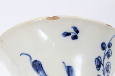 Lot 144 - English pearlware vase, late 18th century, of waisted form, decorated in underglaze blue with flowers, and a diaper pattern on the inside rim, 13.5cm high