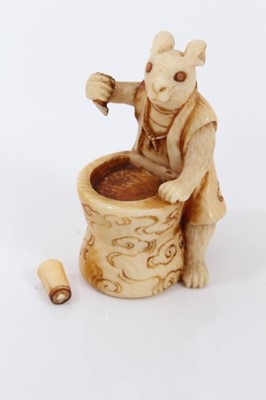 Lot 803 - A Japanese ivory netsuke, in the form of a hare pounding rice