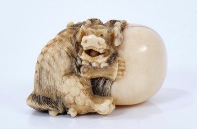 Lot 800 - A Japanese ivory netsuke, in the form of a shi- with a large tarma