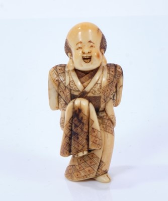 Lot 804 - Minkoku, A Japanese ivory netsuke of a man dancing