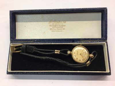 Lot 708 - 9ct gold cased J.W. Benson wristwatch on black strap, boxed