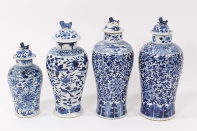 Lot 216 - Four 19th century Chinese blue and white porcelain vases and covers