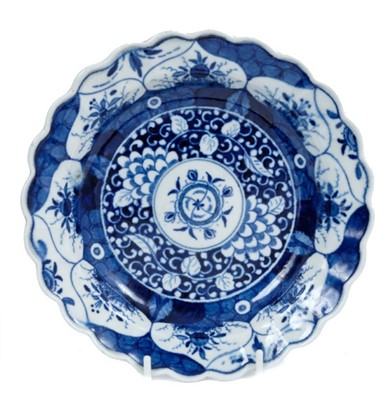 Lot 202 - A Worcester plate, painted in blue with the Kangxi Lotus pattern, circa 1770