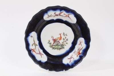 Lot 209 - Derby plate, painted with exotic birds, on a blue ground, circa 1758