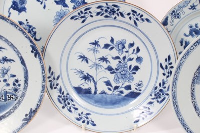 Lot 145 - Nine Chinese blue and white export dishes, 18th century, the largest measuring 31.5cm diameter, the rest approx 22.5cm