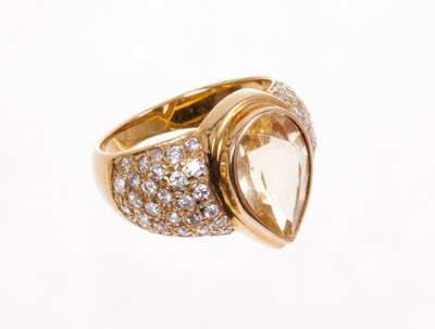 Lot 577 - Yellow sapphire and diamond ring