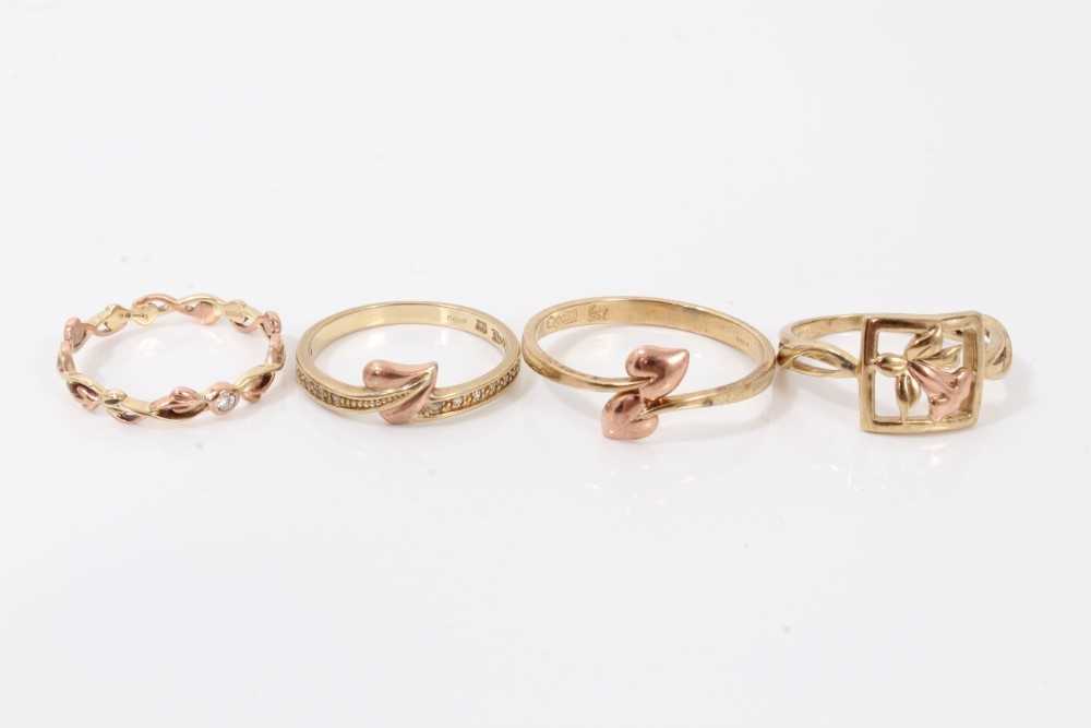Lot 106 - Four Clogau 9ct gold rings to include Tree of Life diamond stacking ring, two other leaf rings and a Daffodil ring