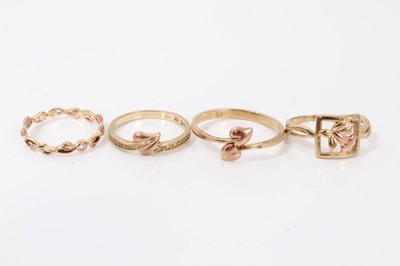 Lot 106 - Four Clogau 9ct gold rings to include Tree of Life diamond stacking ring, two other leaf rings and a Daffodil ring