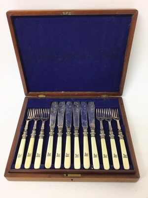 Lot 294 - Victorian canteen of twelve pairs of silver plated fish eaters with engraved decoration and turned ivory handles with engraved armorials in blue baize lined mahogany canteen